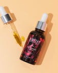 image de l'huile de beauté feu et sa pipette